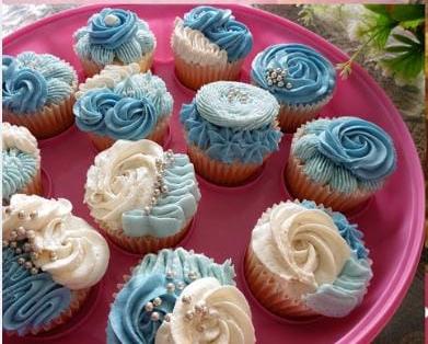 Freshly piped cupcakes